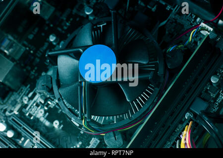 Close up photo with motherboard of computer and its fan. Stock Photo
