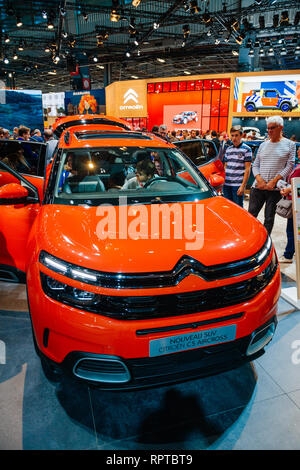 PARIS, FRANCE - OCT 4, 2018: Customers curious people admiring new red electric hybrid plug in Citroen SUV c5 Aircross hybrid at International car exhibition Mondial Paris Motor Show Stock Photo