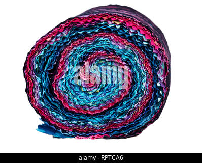 Multi-colored remnants of fabric rolled together to create a pattern Stock Photo