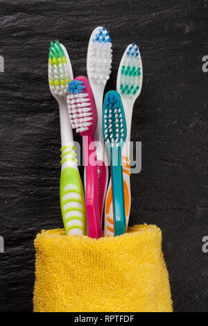 toothbrushes on the black stone background Stock Photo