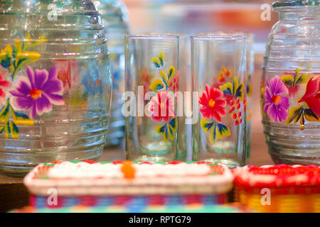 Hand painted Mexican Glass Ware and Woven Basket Arrangment Stock Photo