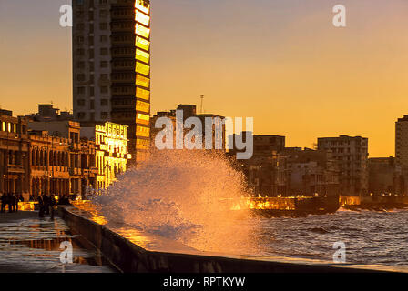 Waves breaking on Malecon at sunset, Havana, Cuba Stock Photo