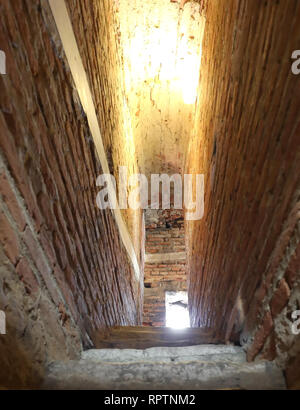 Dungeons of a medieval castle. Passage in the fortress wall. Black and ...