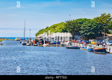7 JUly 2018: Bude, Cornwall, UK - Bude Canal and some of its attractions, boats, people, during the summer heatwave. Stock Photo