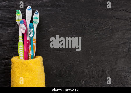 toothbrushes on the black stone background with copy space for your text. Top view Stock Photo
