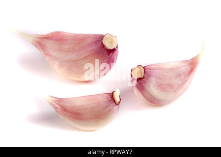 Three garlic cloves isolated on white background Stock Photo