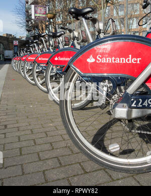 A Santander bike hire docking station in Southwark, London, UK Stock Photo