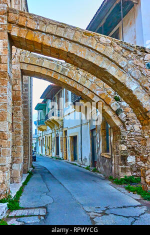 Old street in Larnaca under buttresses of The Djami Kebir mosque, Cyprus Stock Photo