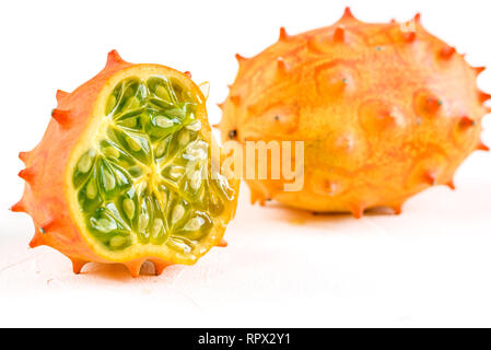 Fresh organic kiwano or horned melon on white background. Stock Photo