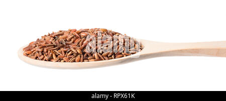 Brown rice in a wooden spoon on a white background Stock Photo