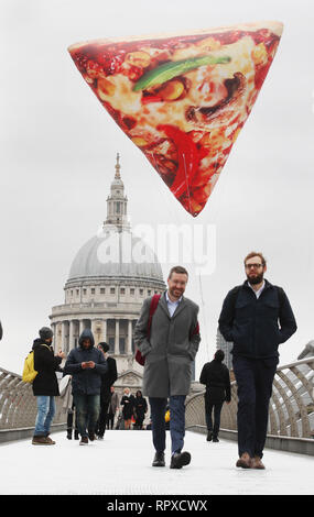 To celebrate the introduction of a new range of 650kcal Delight pizzas to its menu, Domino’s is floating giant, inflatable Slices of Delight around London today to help lift the January blues. 1,000 people who spot and share a picture on Twitter using the #SliceOfDelight hashtag will be rewarded with a free Delight pizza. Pizza lovers up across the country can retweet the snap from @Dominos UK to be included in the 1,000 lucky winners.  Featuring: Atmosphere Where: London, United Kingdom When: 16 Jan 2019 Credit: Joe Pepler/PinPep/WENN.com Stock Photo