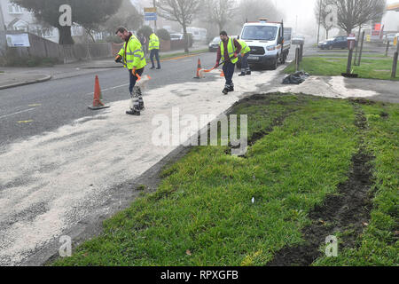 Workers spreading sand on Footscray Road in Eltham where a man and woman in their 70s died after the car they were in was hit by a Ford Transit van which was being pursued by police. Stock Photo