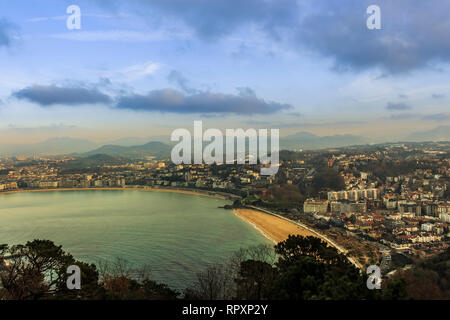 Aerial view of the resort town of San Sebastian in the mountainous Basque Country, Spain taken in the evening Stock Photo