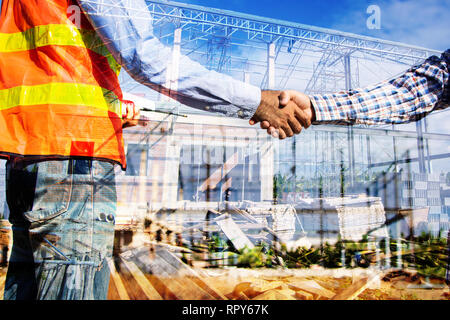 construction worker shake hands and negotiation Stock Photo