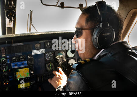 Nepal, aviation, pilot of domestic Dornier 228 aircraft on Tara Air domestic flight to Lukla Stock Photo