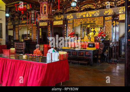 Worshipers in Buddhist Taoist Cheng Hoon Teng Chinese Temple, Melaka, Malaysia. Stock Photo