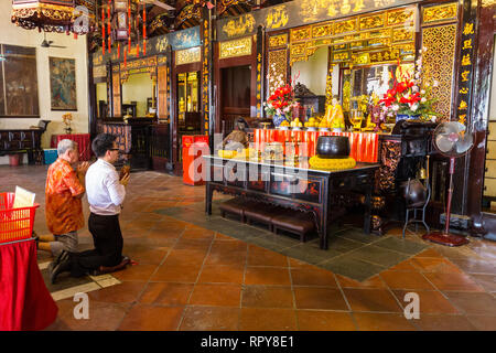 Worshipers in Buddhist Taoist Cheng Hoon Teng Chinese Temple, Melaka, Malaysia. Stock Photo