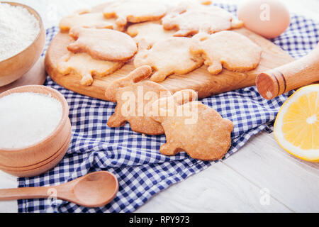 Easter symbol concept. Biscuits with ingredients. Baking Easter cookies bunny-shaped. Home-made food. Stock Photo