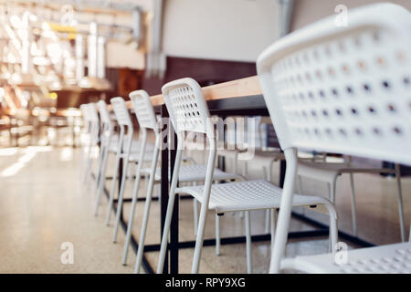 Empty chairs in classrom. Modern furniture. Interior of cafe. Conference hall. Stock Photo