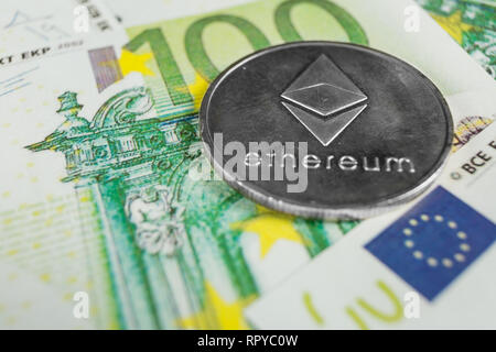 Crypto currency concept - A Ethereum with euro bills Stock Photo