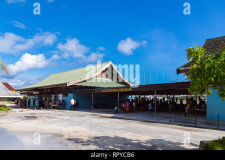 South Tarawa, Kiribati - Jan 8 2015: Passengers waiting for a flight at the terminal of Bonriki International Airport. Air travel in Republic of Kirib Stock Photo