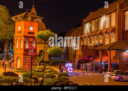 Stadthuys on right at night, Former Dutch Governor's Residence and Town Hall, Built 1650.  Illuminated Trishaw in center, waiting for tourists.  Melak Stock Photo