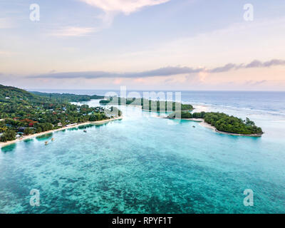 An aerial view of Muri Lagoon at sunrise on Rarotonga in the Cook Islands Stock Photo