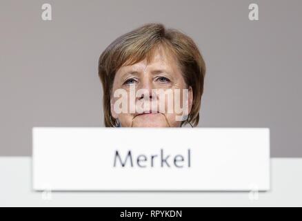 Beijing, Germany. 7th Dec, 2018. German Chancellor Angela Merkel reacts prior to the election of new chairperson of Germany's Christian Democratic Union (CDU) during the party conference in Hamburg, Germany, Dec. 7, 2018. Credit: Shan Yuqi/Xinhua/Alamy Live News Stock Photo