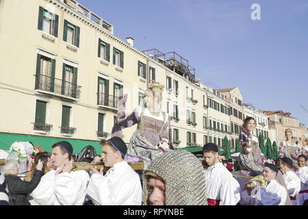 Venice, Italy - February 23 2019: Feast of The Marie Carnival walking parade to St Marks Square. The traditional yearly Festa delle Marie with costumes before crowd, during Venice Carnival 2019 celebrations. Stock Photo