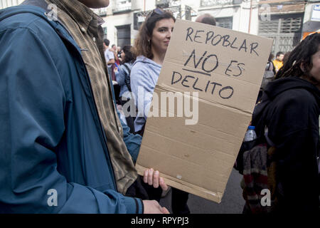 Madrid, Spain. 23rd Feb, 2019. A protester seen holding a placard saying Repopulate is not a crime during the protest.Thousands of people protest in Madrid in support of the Eco village of Fraguas in Guadalajara so that it will not be demolished by the government of Castilla La Mancha. Credit: ZUMA Press, Inc./Alamy Live News Stock Photo