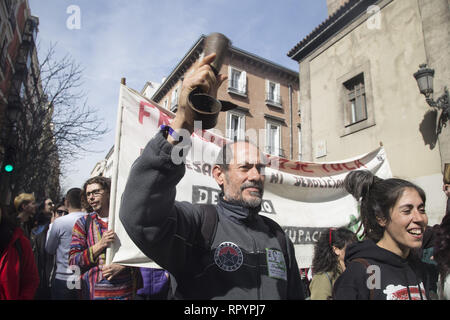 Madrid, Spain. 23rd Feb, 2019. A protester seen holding a cowbell in support of rural areas during the protest.Thousands of people protest in Madrid in support of the Eco village of Fraguas in Guadalajara so that it will not be demolished by the government of Castilla La Mancha. Credit: ZUMA Press, Inc./Alamy Live News Stock Photo