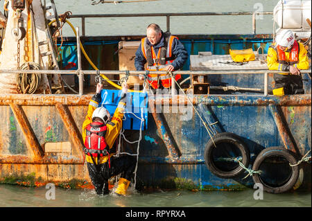 Union Hall, West Cork, Ireland. 23rd Feb, 2019. An RNLI Lifeboat crew member participates in a man overboard demonstration for the general public. The Union Hall lifeboat was called out 10 times in 2018 and once so far this year. Credit: Andy Gibson/Alamy Live News. Stock Photo