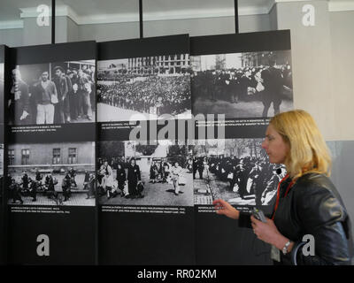 POLAND  -  Auschwitz museum  Tourist sites in the former concentration camp.Tour guide explaining exhibit. Stock Photo