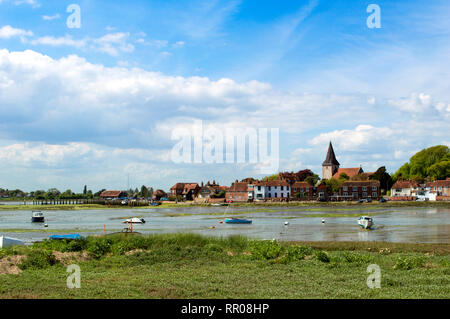 Bosham in May with the tide out, West Sussex, England, Landscape picturesque village harbour with boats and the tide out Stock Photo