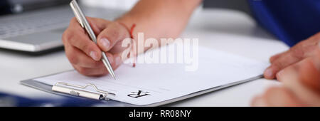 Male doctor hand write prescription at office Stock Photo