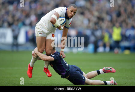 France's Gael Fickou is tackled during the Guinness Six Nations match at the Stade De France, Paris. Stock Photo