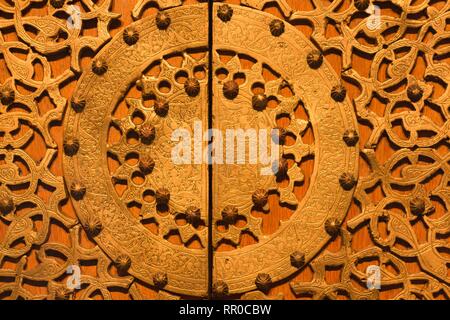 Beautiful ornament made of precious materials. The ornament is made on the wooden surface of which for many years. Stock Photo