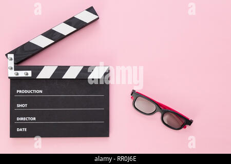 black clapperboard isolated on color background, flat lay Stock Photo