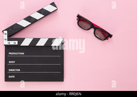 black clapperboard isolated on color background, flat lay Stock Photo