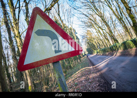 Sign for a sharp left turn in the road Stock Photo