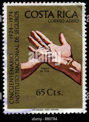 Postage stramp from Costa Rica in the Costa Rican Insurance Institute, 50th anniversary series issued in 1974 Stock Photo