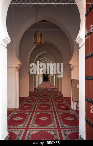 Archways in The Koutoubia Mosque or Kutubiyya Mosque and minaret located at medina quarter of Marrakech , Morocco. Inside interior arches Stock Photo