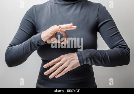 Woman speaks sign language deaf people. Stock Photo