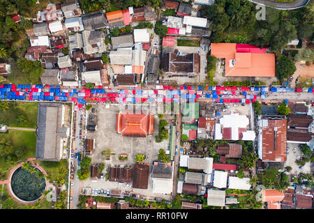 (view from above) Stunning aerial view of colored night market tents on the Sisavangvong Road in Luang Prabang, Laos. Stock Photo