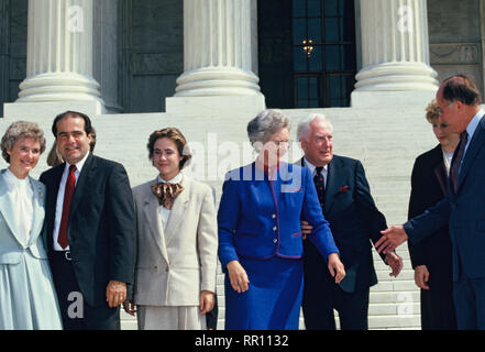 Antonin Gregory Scalia on the day that he became an associate justice of the Supreme Court with his wife,  Maureen Scalia and daughter.  Also, Supreme Court chief Justice Warren Burger, and the new Supreme Court Chief Justice William William Hubbs Rehnquist  Photo by Dennis Brack Stock Photo