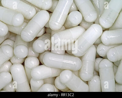 Macro of white pills background, close up Stock Photo