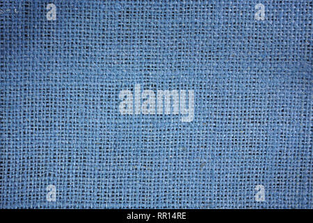 Blue-dyed burlap fabric on a black background Stock Photo