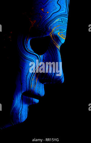 Robot blue face mask side view close up with contoured textured skin and blank eyes. Black background and space for text. Artificial intelligence conc Stock Photo