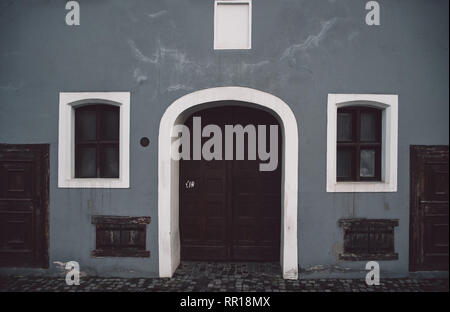 European style facade with rolling shutter on windows and door Stock Photo