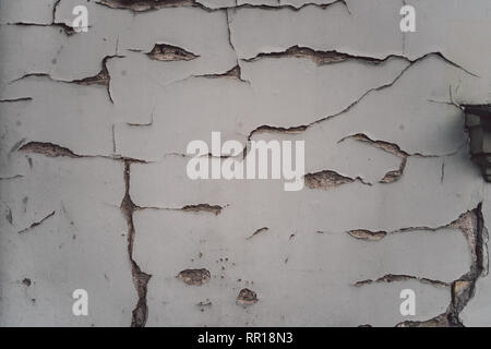 White plaster wall with cracks Stock Photo